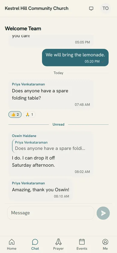 A group conversation in the member app: messages, a reply quote, reactions and the composer.